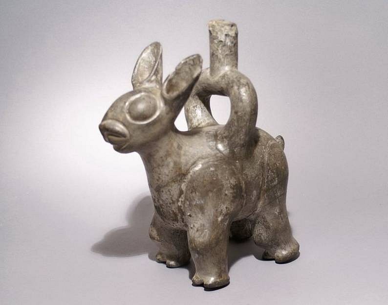 Peru, Viru ceramic greyware single spout vessel in the form of a Viscaya
A ceramic single spout vessel in the form of a standing Viscay, a large member of the rabbit family, noted by its long ears.
Media: Ceramic
Dimensions: H. 9 1/2
$7,500
92047