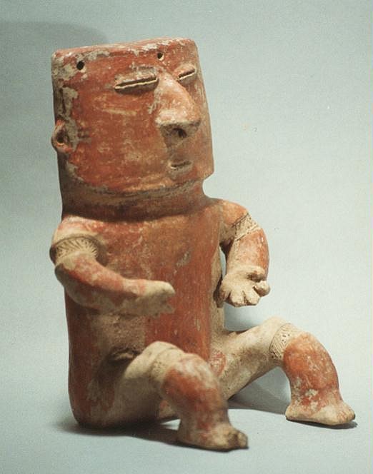 Colombia, Quimbaya Seated Male Warrior with Gold Nose Ornament
This male figure sculpted in solid red clay is in a sitting position with outstretched hands.  He is wearing his original ancient gold crescent nose ring.  His arms and legs are decorated with incised geometric  banded depressions, representing ligature bands intended to constrict the flow of blood.  It was believed that this strengthened the adjacent muscles.  Similar examples are illustrated in "Columbia Before Columbus," by Armand J. Labbe, Rizzoli, NY 1986, p. 75.

Media: Ceramic
Dimensions: Height 8 in. x Width 7 in.
$4,800
94272B