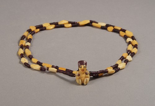 Nazca necklace with bone and syondylus beads and a minature female pendant $6,500