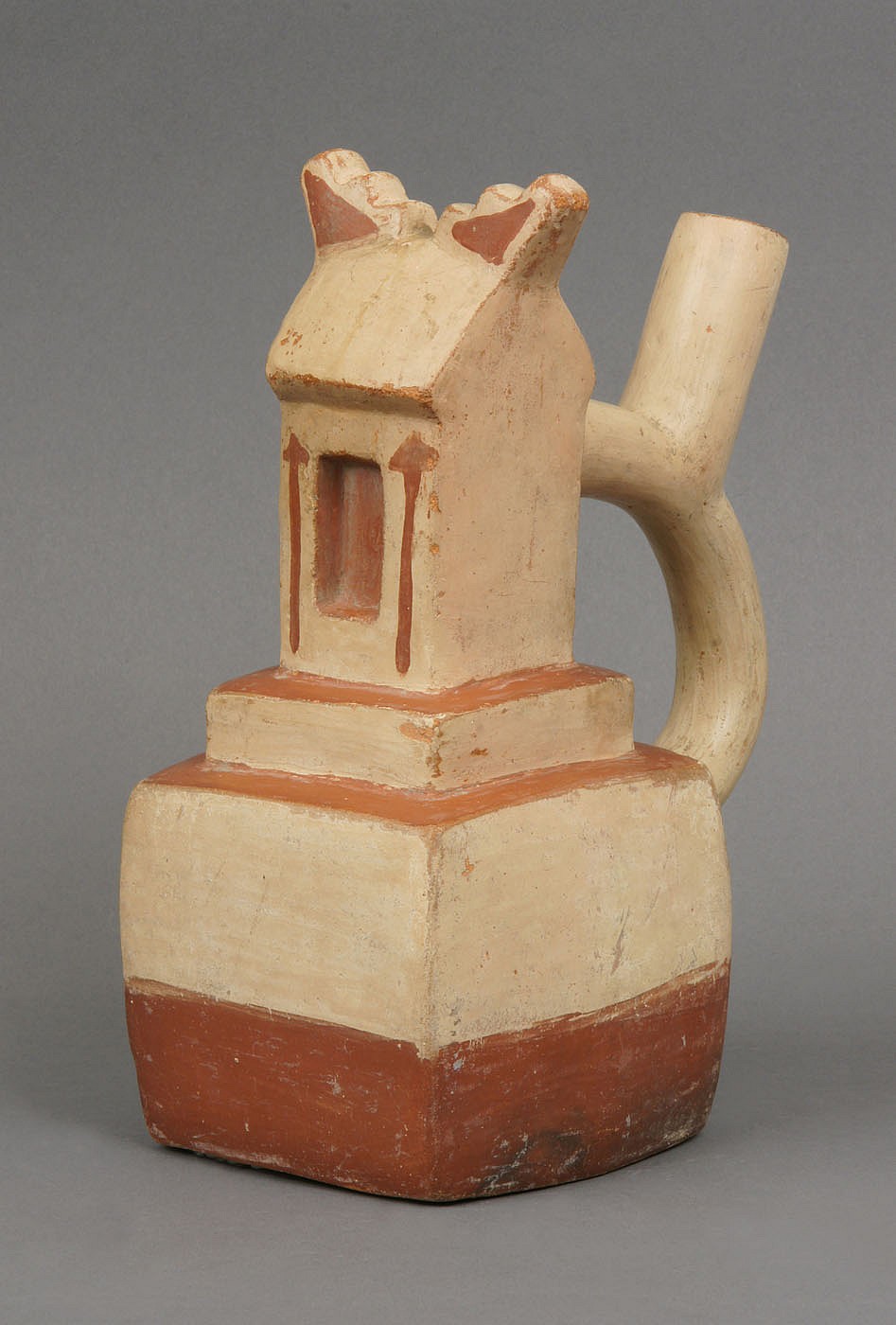 Peru, Moche III Ceramic Vessel in the Form of a Gabled House
This house or religious center is detailed with a gabled roof and stucco decoration with painted  spears.   A priest is portrayed in the doorway in full regalia.    Ex Collection Of Sue Tishman, prior to 1970.
Media: Ceramic
Dimensions: Height  9"
$7,000
M7019