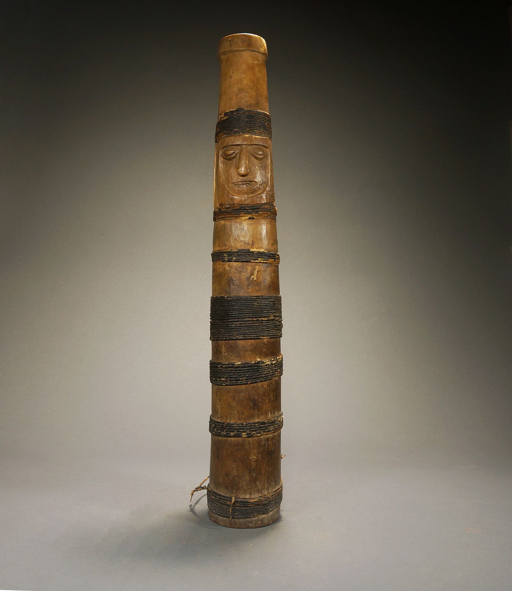 Peru, South Coast Wari Carved Wooden Trumpet with Face
This Wari trumpet has been wrapped in bands with a tar covered cotton rope. It has the typical trumpet pitch.  This is a rare object to find so intact.
Media: Wood
Dimensions: Length: 16.5 Inches
$7,500
n3018