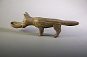 Peru, Wari Carved Wooden Dog with Bowl in Mouth
Wood