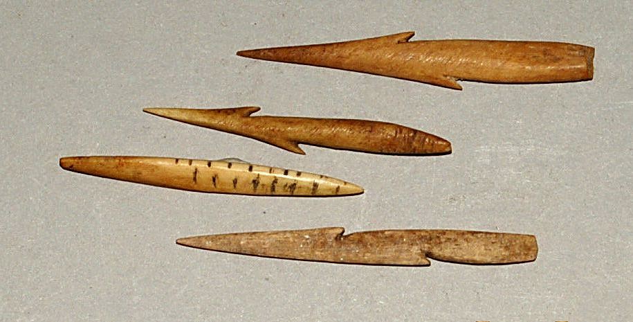 Chile, Three Carved Bone Barbs with Measuring Tool
These barbs were lashed to a cigar-shaped stone sinker.  The measuring tool was marked with lines and dots on the edge.   These markings allowed the maker to carve the spikes in the same place on each barb .
Period: Chile, Arica, Far North Coast, c. AD 900 - 1200
Media: Bone
Dimensions: Length: 2"
n6044