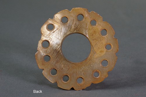 Peru - Early Middle Horizon Mother of Pearl Round Ear Spool Front with 13 Petals Price Upon Request