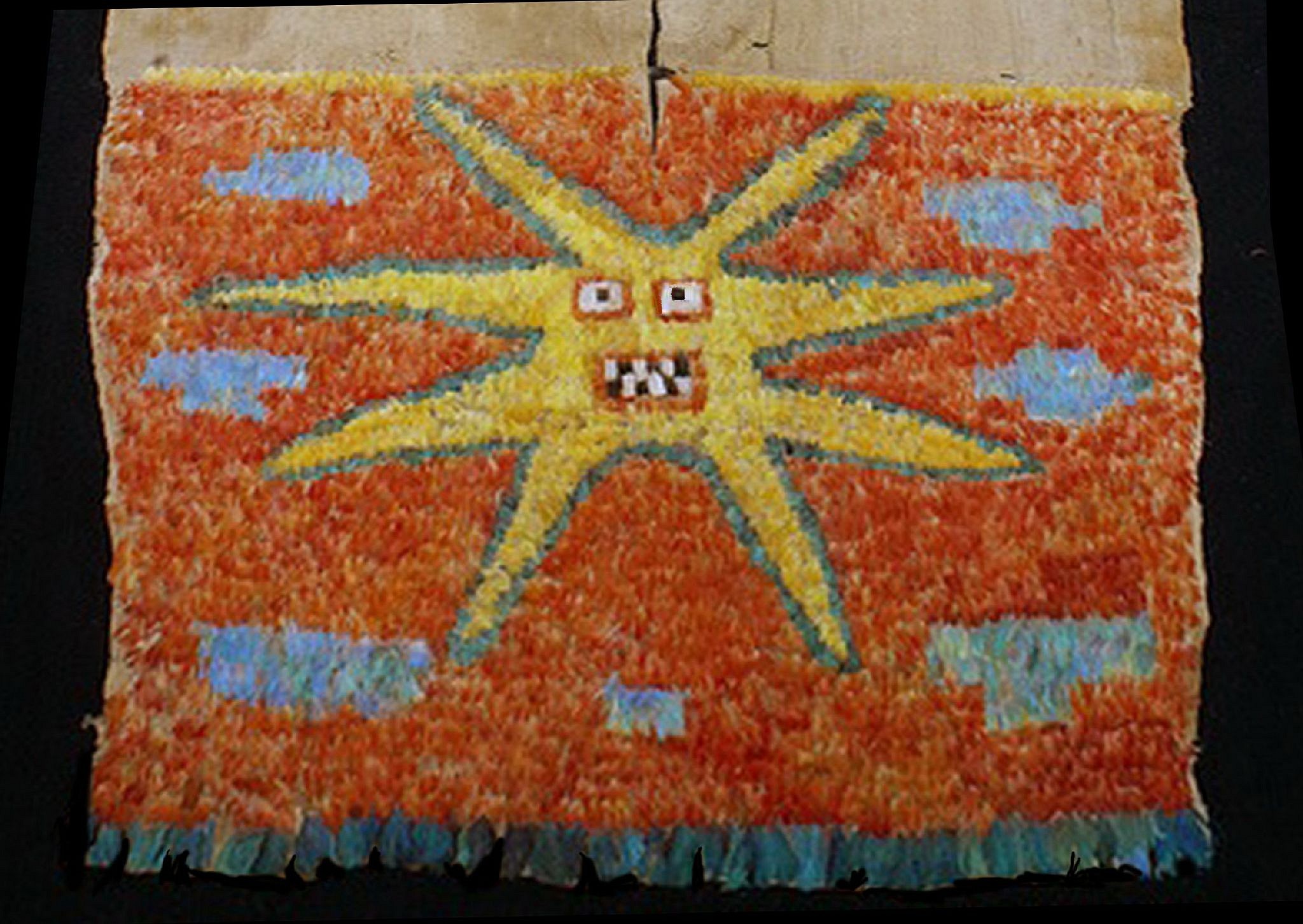 Peru, Early Nazca/Sihuas Feather Tunic With the Eight Pointed Star On an Orange Ground
This tunic with an eight-pointed star motif, also referred to as the Radiant Sun, is similar to other published tunics.  The front part is a complete star with assorted color blocks of blue feathers.  The back of the tunic has only two blue stripes on an orange ground with a fringe of turquoise macaw tail feathers.  The blue feathers do not contain blue pigment, but instead are natural prisms which brightly reflect the color of the sky.  I believe that all the feathers are from the Scarlet, Yellow, and Blue Macaws.  Tunics with similar motifs are illustrated in TEXTILE ART OF PERU, 1989, L.L. Editores, Lima. pages145,-147 & 163.  Usually tunics with an eight-pointed star motif are from the Nazca region, from the South coast of Peru.   This tunic was found in the Sihuas region near the city of Arequipa and predates the Nazca by 500 years.  The backing fabric is fragile and needs proper conservation.
Media: Textile
Dimensions: Length 56"  x Width 35"  (142cm X 88.9cm)
&bull;SOLD
N1028