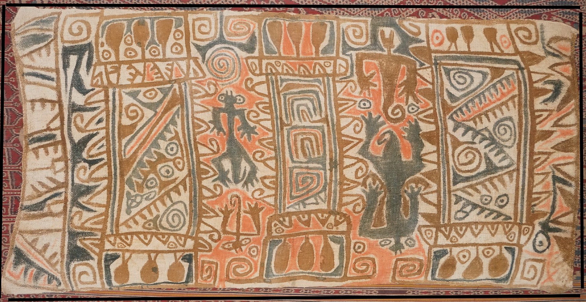 Peru, Chancay Painted Cotton Panel with Four Abstract Figures and Symbols
The cotton panel is painted in blue, tan and orange.  The drawing can be interpreted as 3 woven panels or tunics with fringes, each decorated with different abstract designs.  On each side of the central panel are two abstract creatures with curly tails on an orange ground.
Media: Textile
Dimensions: Length: 46" x Width: 23"
$7,500
n6056h