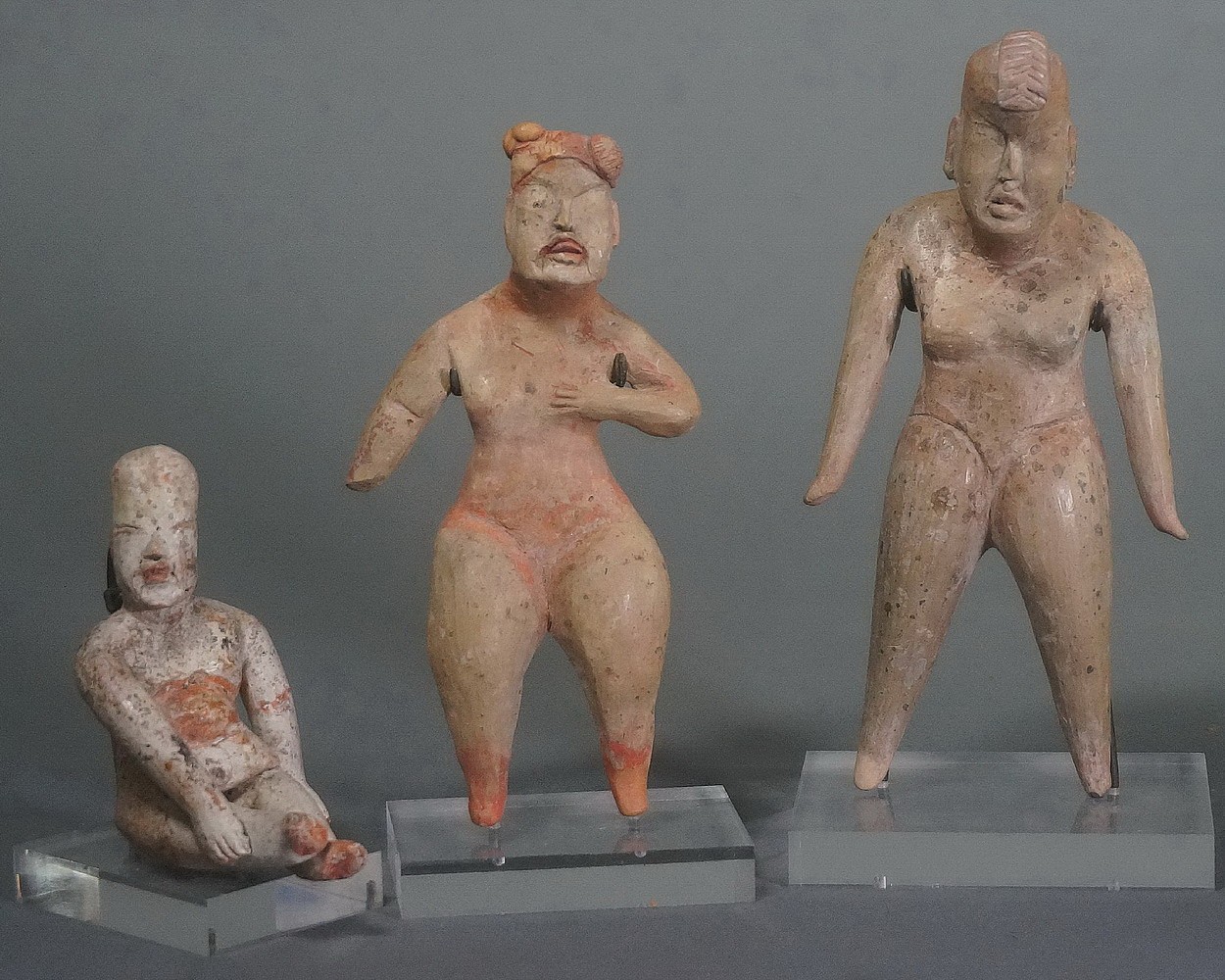 Mexico, Set of 3 Olmec Ceramic Figurines
These three figurines were exhibited together at Taguchi Fine Art in Tokyo and are illustrated in â€œJAGUAR'S CHILDREN: The Art of The Olmec,â€ May 7 - June 30, 2007.  From left to right: seated cross-legged female with kaolin and cinnabar, standing eyeless female figure with traces of cinnabar, and standing figure with traces of kaolin slip.
Media: Ceramic
Dimensions: Height: 6.9 cm, 12 cm, and 13 cm.
Price Upon Request
n7064