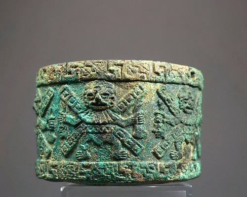 Moche Cylindrical Container with 6 Decapitators in High Relief $12,000