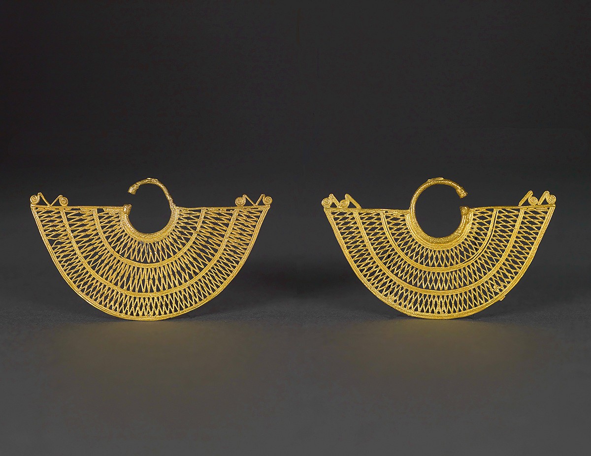 Colombia, The Mysterious History of Pre-Colombian Gold
&bull;SOLD What is Pre-Columbian Gold?&nbsp;&nbsp; 
The cultural period before the Spanish Conquest is known as the PRE-COLUMBIAN ERA.
Pre-Columbian gold refers to the spectacular body of objects wrought from this precious and universally valued metal, which was produced by the indigenous cultures of the Americas prior to the arrival of Christopher Columbus in 1492.
The American continent was originally populated over 17,000 years ago by people who migrated between Asia and North America across the Bering Strait land bridge.
Waves of migration following the Woolly Mammoth moved down the North American continent, through the Isthmus of Panama, ultimately reaching the southernmost tip of South America.&nbsp; These early peoples established settlements in a range of diverse habitats, from wet tropical lowlands and arid deserts, to the highlands of the Andes.
&nbsp;
The Sin&uacute; Culture
Overview of the Culture
The SINU people emerged in the fertile flood plains of the Caribbean lowlands of present-day northern Colombia. Collectively the various Sin&uacute; groups or communities, as well their ancestral territory, are also referred to as the GRAN ZENU or FINZENU.
This vast region of swamps, savannas, and forests surrounding the San Jorge, Nech&iacute;, Sin&uacute;, and lower Cauca rivers is fed by rain runoff and melting snows from the mountains (cordillera).
Long before the arrival of Spanish explorers and colonialists in the 1500s, the Pre-Columbian Sin&uacute; developed a highly sophisticated network of drainage and irrigation canals, earthworks, and raised fields to manage the floods that occurred seasonally in the inland deltas, and to cultivate the rich alluvial soils they yielded.&nbsp;
Extending over 500,000 hectares, this was the largest contiguous area of land under cultivation in the ancient Americas, sustaining the most ingenious and complex hydraulic system ever constructed on the sub-continent.
The Sin&uacute; or Zen&uacute; tradition spans the period 200 BC&ndash;AD 1660.&nbsp;
The culture flourished among the waterways and grasslands of the river flood plains between AD 500-1000, reaching its height of political influence, wealth, and agricultural production.&nbsp;
Due to severe climactic and environmental changes, the Sin&uacute; began to retreat to higher uplands in the west soon thereafter, surviving there until around the time of the Spanish Conquest in the 16th century.
The works in this collection date from this later phase, circa AD 1000-1500,
They and display the artistic virtuosity of a highly complex and economically successful society.
After this period, however, Sin&uacute; civilization went into decline. Their labor was drafted for Spanish mining and enterprises, while their treasury of gold was seized, melted down, and shipped to Europe, where it helped fund the Spanish Empire, the Vatican, and even the building of the Spanish Armada.
But at its zenith, the stability and prosperity afforded by their mixed economy of agriculture and trade was reflected in Sin&uacute; art and craftsmanship, especially metallurgy.
Gold Centers and Goldsmiths
The numerous Sin&uacute; settlements supported a large community of goldsmiths who produced a wealth of gold ornamentation that shared a common style, technology, and iconography.
Important goldsmith centers were established, specializing in the mass production of nasal ornaments, false filigree ear ornaments, in addition to other characteristic ritual insignia, such as mammiform chest plaques and conical phallus covers.&nbsp;
These ancient works of art have been found in tombs and burial mounds scattered throughout the Gran Zen&uacute; sphere.
Mythology and Political Power
Sin&uacute; society was hierarchical, ruled by a Lord or Cacique (or group of chieftains) whose authority was supported by the essential figure of the shaman-priest.&nbsp; 
Gold was associated with the sun and its golden rays and thought to be a source of sacred and celestial power for both ruler and shaman.
Gold was the source of Sin&uacute; power &ndash; used as a form of ceremonial adornment, as well as an essential medium for expressing social, religious, and ritual themes. 
Naturally, it was also inherently emblematic of rank and prestige.
Competition among the many chieftaincies for worldly and spiritual power, as well as for riches and valuable trade goods, spurred the production and acquisition of beautifully crafted gold objects.
The greater the status of this individual, the greater his wealth of gold, which was displayed not only in life, but in the afterlife.&nbsp;
Craftsmen&ndash;&ndash;goldsmiths, weavers, potters&ndash;&ndash;represented a specialized class that was ranked above the ordinary people.&nbsp; 
The goldsmiths' exalted status in particular was derived from their seemingly supernatural ability to transform metal into precious, ritually significant objects that gave tangible form to symbolic and cosmological ideas. 
Iconography and Cosmology
Assemblages of gold adornment and insignia bedecked important Sin&uacute; personages&ndash;&ndash;both living and dead, male and female&ndash; were intended to project their divine ancestry, elite status, power, and wealth, in this world and the afterlife.&nbsp;
Being richly attired in gold, a material of spiritual essence and efficacy was a vehicle for metaphysical transformation and shamanic metamorphosis.&nbsp;
Many of the animal figures represented in Sin&uacute; goldwork reinforced this theme: jaguars, water birds, crocodiles, frogs, deer, and other symbolic fauna had a mythical and symbolic role in Sin&uacute; cosmology.&nbsp;
Animals that were emblematic of water and fertility were especially prominent, reflecting the Sin&uacute; peoples' environment as well as their cosmological beliefs. 
There is a conspicuous lack of emphasis on warrior themes, however, but a pronounced focus on fecundity and female symbolism on the other hand.
The most important of these water spirits was a golden crocodile&ndash;&ndash;a being that is frequently represented in the ancient iconography (see cats. 42 and 43).
Since such birds flit, swim, walk and fly freely between water, land, and sky, they supplied rich metaphors for an ability to mediate between all worlds, whether nature or spirit. The symbolic relationship between birds and human beings was therefore a primary aesthetic theme for Sin&uacute; goldsmiths.
Adornment for Shamanic and Spiritual Transcendence / Symbolism of the Feminine
In addition to symbolizing solar potency, gold served to link the lower world&ndash;&ndash;the earthly domain of human beings&ndash;&ndash;with the upper world, that was a realm of deities.&nbsp;
Figural representations&mdash;of human personages, real and imaginary creatures, or hybrid animal/human beings&ndash;&ndash;seemingly reflect the Sin&uacute; vision of an ideal and primordial cosmos.
The creative energy and attention of Sin&uacute; goldsmiths was directed towards communication with these divine forces.&nbsp;
This fundamentally peaceful intention stands in marked contrast to the prevailing European approach, which especially valued gold as a medium for projecting the invulnerability and strength of its warriors, as well as a conspicuous measure of wealth and power.&nbsp; 
These two divergent cultural concepts clashed on an epic scale when the Spanish Conquistadors arrived in the New World.
The primary role of Sin&uacute; gold, therefore, was to affirm and enhance the spiritual nature and symbolic qualities of its wearer.
Generally, the works that date to the earlier era of Sin&uacute; goldworking (AD 700-1000) tend to be more naturalistic in style and larger in size.&nbsp; The latter phase of the tradition (AD1000-1400) is noted for the greater abstraction and stylization of image and form.&nbsp;&nbsp;
&nbsp;
Asiatic Origin of Pre-Columbian Gold?
Austrian archaeologist Robert Heine-Geldern presented strong evidence to suggest an Asiatic origin for pre-Columbian metallurgy in a 1954 study in which he draws strong comparisons between Chinese and Chavin gold work.&nbsp; The connection between coastal China and Peru would appear to have begun around the end of the 8th century B.C. and to have continued through to the Mochica period in the 4th century B.C.&nbsp; Around 333 B.C. trans-Pacific voyages of the Dongson culture of South-East Asia may have begun, led by Chinese refugees.
Heine-Geldern sites the following stylistic elements in pre-Colombian art as potential indicators of Asiatic influence:
&nbsp;&nbsp;&nbsp;&nbsp;&nbsp;&nbsp;&nbsp;&nbsp;&nbsp;&nbsp;&nbsp; &ldquo;Disk-topped, spiral topped, and animal-effigy-topped garment pins of the Central Andes; in needles, hand axes, star-shaped mace heads, tweezers, and the very widely recurring double S form spirals and twisted rope design ornamentation.&nbsp; Other instances cited include cast filigree bells and the use of bell pendants on jewelry&rdquo; (p.173).
&nbsp;
Heine-Gelderen also suggests that granulation, mise-en-couleur, and the use of tumbaga (metalworking techniques to be discussed later) may have been migrated in from China.
Ancient sailors who crossed the Pacific probably took the same route as the one followed for two hundred years by Spanish galleons on their voyages from the Philippines to Mexico and Peru.
&nbsp;
Similarities to Shang Dynasty Chinese Bronze 
This shamanistic aspect has an interesting analogy in ancient Chinese culture.&nbsp; &nbsp;
Sin&uacute; metallurgy is aesthetically and technologically related to the indigenous gold working traditions of northern Colombia and the Central American cultures of Costa Rica and Panama
Similarly, Sin&uacute; goldwork greatly influenced the art of neighboring cultural traditions, including that of the Tairona people of northern Colombia and of the societies situated around the Bay of Urab&aacute;, which is located at the junction of the Central American isthmus and the continent of South America.
Yet despite a vast spatial divide and a difference of some 2500 years, Sin&uacute; goldsmithing also finds an extraordinary parallel in the development of bronze art in Shang Dynasty culture. 
This is due to a unique conjunction of factors. In both instances, the sophisticated knowledge and working of metal alloys (bronze in China, gold in Colombia) was strongly associated with archaic societies built upon the creation of irrigation canals that, in turn, facilitated intensive agriculture and trading activity. The surplus wealth generated by these activities spurred the rise of a class of specialized artisans who could be dedicated to luxury craft production rather than mere subsistence. 
Furthermore, both Sin&uacute; and Shang cultures ascribed a mystical or magical dimension to the art of metal working, producing artifacts that were not only technically and artistically complex but also imbued with shamanic significance.&nbsp; 
&nbsp;
SINU GOLD TECHNOLOGY
The Riches of El Dorado, Empire of Gold
The abundance of gold in El Dorado, the New World, had excited the Spanish conquistadores.
While the finely wrought objects elicited admiration and awe, much of what the conquerors could plunder, seize, or trade in Colombia and elsewhere in the Americas was melted down in the 16th and 17th centuries and shipped back to Spain for the Church's and Royal coffers.
Although the Sin&uacute; region was heavily plundered, the invaders were not aware of the centuries-worth of gold buried in Sin&uacute; tombs and necropoli.&nbsp;
This hidden treasure only came to light as the Sin&uacute; zone began to be developed in the late 19th century.&nbsp;
Subsequently, the intensive plowing of fields and building of roads in the modern era led to the further accidental discovery of Sin&uacute; funerary mounds and cemeteries, which held burial offerings of pottery and textiles as well as goldwork.
Heather Lechtman of the Massachusetts Institute of Technology (MIT) has, done pioneering work on Pre-Columbian gold, analyzing the inventive methods of fabrication (lost-wax casting, depletion gilding, annealing, binary and ternary alloys) devised by Pre-Hispanic artisans and metal smiths.
The inventory of complex techniques employed to fashion such magnificent pieces are documented in this collection.
Gold Alloys and Tumbaga
Alluvial gold deposits are found in the river beds of streams flowing from the Andes.&nbsp;
Archaeologists have identified one site in the Sin&uacute; region (Zenufana) which appears to be the most abundant source of the gold employed in their metal arts.
These deposits naturally contained a mixture of gold, silver, and copper in various proportions; small amounts of other impurities are also present in the metal.
Native metals smiths deliberately manipulated the variable components of both naturally-occurring and man-made alloys to produce a range of surface color and tonal contrast, which could be further enhanced by depletion gilding (mise-en couleur) and polishing.&nbsp;
The Sin&uacute; ascribed symbolic and spiritual significance to subtle distinctions in the colors and textures of the metal, as well as to the different light-reflective properties of matte and shiny surfaces.&nbsp; &nbsp;
The Sinu's heightened awareness to such nuances meant that even the distinctive scent that copper-based alloys emit was highly appreciated and acquired symbolic value, conjuring associations with toads, female sexuality and procreation.&nbsp;&nbsp;
Much Sin&uacute; ornamentation is made from tumbaga, a Spanish term for a copper-enriched gold alloy (not, as is sometimes mistakenly believed, for a gold alloy of less than 20 carats).
The composition of tumbaga can vary widely, and in fact, many of the cast tumbaga ornaments in this collection that have been scientifically tested and reveal a high gold content (in some cases more than 80 percent).&nbsp;
While tumbaga objects tend to be more fragile than those worked and hammered from high-grade gold (such as plaques, discs and bands), this gold-copper alloy has a lower melting point, which allows for greater refinement of detail in the casting.
This freedom stimulated the artistic imagination and creativity of the Sin&uacute; goldsmiths, who fabricated fantastical three-dimensional images of birds, amphibians, and other animals found in the wetlands, in addition to mythical creatures, anthropomorphic forms, and intricate geometric designs.
By selectively treating the tumbaga with depletion gilding, i.e. with a combination of heat and mild oxalic acids (derived from plants such as Oxalis pubescens), the metal smith could remove the copper or silver from the outer surface.&nbsp; The exposed interior layer of rich gold was then burnished to produce an intensely gilded finish.&nbsp;
Similarly, any silver present in the alloy could be attacked by a vegetal acid to reveal the deeper reddish color of the constituent copper.&nbsp; When large amounts of copper are present, moreover, the gold alloy may display a greenish tint, which turns to malachite green when oxidized.&nbsp;
(The patinas seen in pre-Columbian casting are quite different, therefore, from Shang Dynasty bronzes that have been in the ground for over 2000 years.)
The ability to control and alter an object's coloration seemingly served a metaphorical point for ancient Colombian goldsmiths, who sought color effects ranging from yellow to pink and red.
This is beautifully illustrated by a staff finial depicting a jaguar shown in cat. 95. Throughout South America the feline is an icon of shamanic transformation. Surely, the "magical" capacity to bring out the color hidden within a metal along is a dramatic and visual expression of that ubiquitous theme.&nbsp;&nbsp;
Lost-wax Casting
Lost-wax casting&ndash;&ndash;another quintessential Sin&uacute; technique&ndash;&ndash;entailed a multipart process.
Firstly, the model was sculpted from clay.

The form was covered with a layer of finely powdered charcoal, then coated with beeswax and encased in another layer of heavy clay.
The object was fired so that the hot wax could flow out of tubular vents in the clay casing to be replaced with molten gold. As the metal hardened, it took on the shape of the embedded model.
Finally, the outer clay shell was cracked open, exposing the finished gold artifact to be polished or otherwise elaborated.&nbsp;
The most skillful master goldsmiths had the dexterity to cast multiple adjoining figures, creating complicated items such as the striking pendant bearing forty eight ducks that is shown in cat. 69.&nbsp;&nbsp;&nbsp;

The hallmark of Sin&uacute; goldwork is, undoubtedly, the use of cast or "false-filigree" decoration.&nbsp;
 
&nbsp;
AUTHENTICATION OF ARCHAEOLOGICAL GOLD
(From Emmerich, p.170-172).
Forgeries
The oldest known forgery of a pre-Columbian gold object is from the 17th or 18th century, of a brass eagle complete with royal crown and was found in late 1960s (plate 79 in Emmerich).
Tremendous growth in interest in archeological gold has contributed to a massive amount of forgeries.
There are two ways to prove that something has been forged; technical proof and stylistic proof.&nbsp;
Technical proof includes things like spotting the wrong alloy; stylistic proof is in the design of the piece.&nbsp; Often times an expert will notice a stylistic error which will in turn lead to technical testing.
&nbsp;
Gold art work can be authenticated technically by several methods:

Determining whether the particular alloy was used in Pre-Columbian or contemporary times.
Determining which tools were used to create the work.
Determining whether acids were used to create an artificial patina.
Particle induced x-ray emission (companies such as CIRAM and ARCANE).
Elemental analysis.

&nbsp;
Or, a true expert can authentic a piece using this type of stylistic critieria:

Incorrect glyphs.
Errors in copying from original models, which would be recognized by an expert who had seen the originals.
Mixing of stylistic elements from two separate cultures or time periods.
Pseudo-primitiveness &ndash; intentionally crafting an artwork with bad craftsmanship in an attempt to make it look primitive, when in actually the culture it is supposed to represent had high quality craftsmanship.
Unrealistic Ssylistic departure from the canon of the culture the forger is trying to imitate, in an attempt to make a piece look more rare.

&nbsp;
Authentication by Robert Sonin
All of the works in the collection have been authenticated by the late Robert Sonin (1926-2011), a renowned expert on Pre-Columbian metallurgy who consulted with major museums, art dealers, conservators, and auction houses, and collaborated with institutions such as the American Museum of Natural History.&nbsp; His notes are on record at the Princeton University Art Museum.
&nbsp;
&nbsp;
&nbsp;
Selling Points of the Collection
&nbsp;

Largest and most definitive collection of museum quality Sin&uacute; gold outside of the Gold Museum (Museo del Oro) in Bogota, Columbia.

&nbsp;

Over 100 unique objects; combined weight of 6.6 kilos, including many high-status adornments identical to those published in reference literature.

&nbsp;

Authenticated by an array of experts, including the late Robert Sonin, Warwick Bray, PhD, Professor Emeritus at the University of London, and renowned metallurgist Anna T. Bennett, PhD.

&nbsp;

Provenance from before 1996 Memorandum of Understanding treaty between the US and the Government of Colombia.

&nbsp;

Gold was considered by the Sin&uacute; as a symbolic source of power - used for ceremonial adornment, and as a medium for expression social, religious, and ritual themes.

&nbsp;

Gold was associated with the sun and thought to be a source of celestial and sacred power by the Sin&uacute;.

&nbsp;

Goldsmiths were considered an exalted class for their ability to transform metal in to sacred objects; a similar parallel exists in Chinese culture.

&nbsp;

Sin&uacute; gold has many similarities with Chinese bronze work from the Shang Dynasty, including sharing a foundation of a culture built upon a network of irrigation canals, and a surplus of wealth that allowed a technically skilled artisan class to flourish.

&nbsp;

Sin&uacute; and Shang cultures both ascribe a mystical dimension to the art of metal working, and both created works that were believed to be imbued with shamanic significance.

&nbsp;
&nbsp;
&nbsp;
&nbsp;
&nbsp;
&nbsp;
&nbsp;