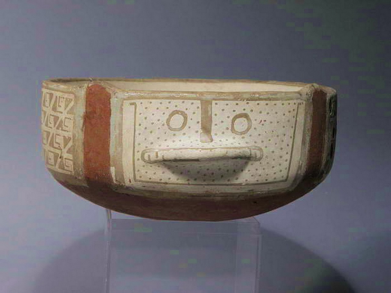 Chile, Diaguita Phase II Shallow Bowl with Animal Face and Step Frets
This second phase Diaguita bowl exhibits a ornithomorph with a protruding mouth and a small protrubance in the rear. The high outer walls are decorated with a band of repeating step fret symbols.  A similar bowl is illustrated in "Chile Indigena, Museo Arqueologico De Santiago,Chile,"  pl. 76.
Media: Ceramic
Dimensions: Diameter 7" x Height 3 1/2"
$4,250
M3143