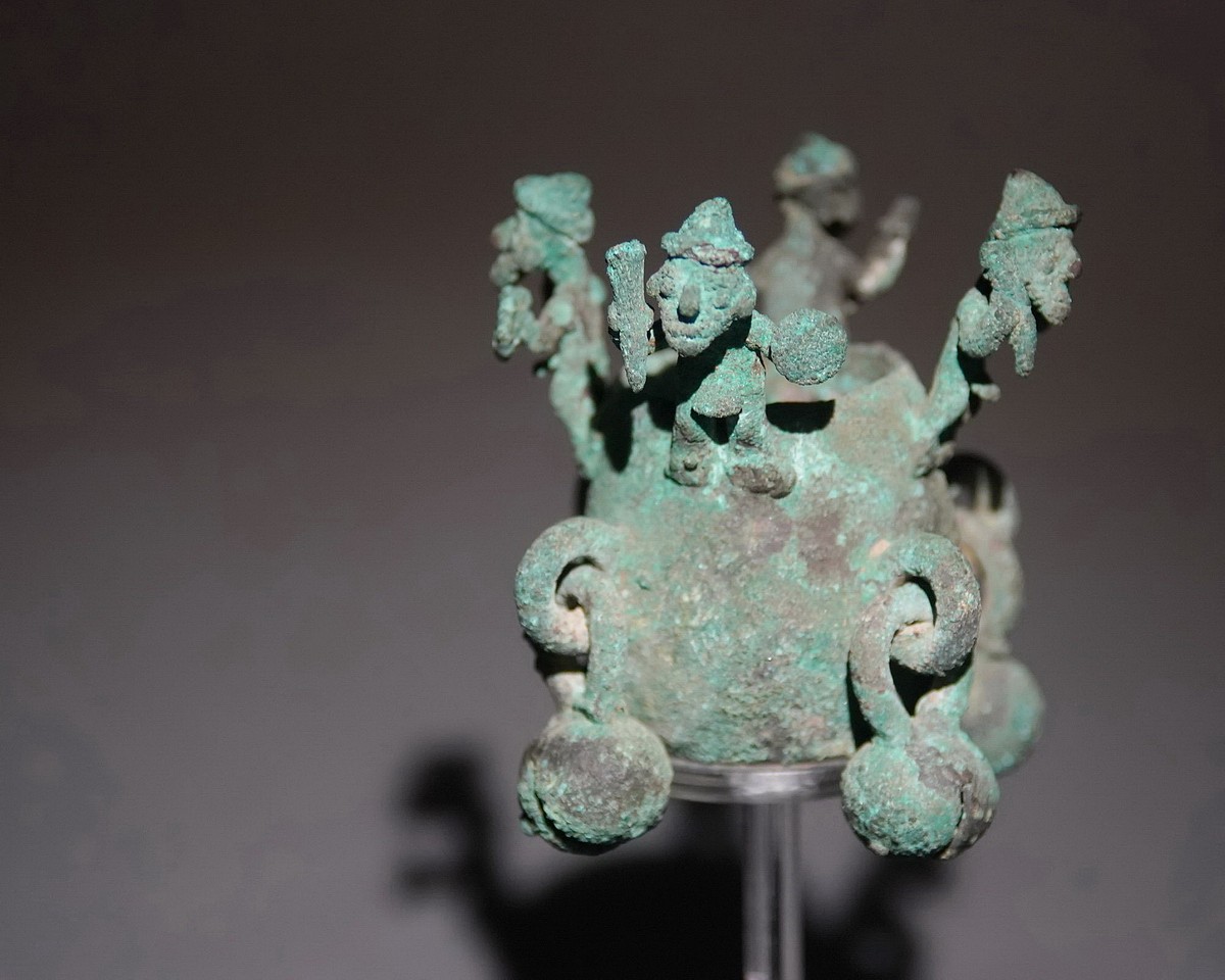 Peru, Chimu Lost Wax Cast Bronze Finial with Four Warriors
Metal objects that are cast with rings or bells that move to make a sound are known as idiophones.  Each warrior wears a loincloth and holds a club in one hand and a shield in the other.  Each of the loops around the shaft holds a bell, which when moved, clanks against the shaft.
Period: Peru, Chimu, North Coast, c. AD 900 - 1350
Media: Metal
Dimensions: Height: 2 3/4" x Width: 3:
$5,500
P1038