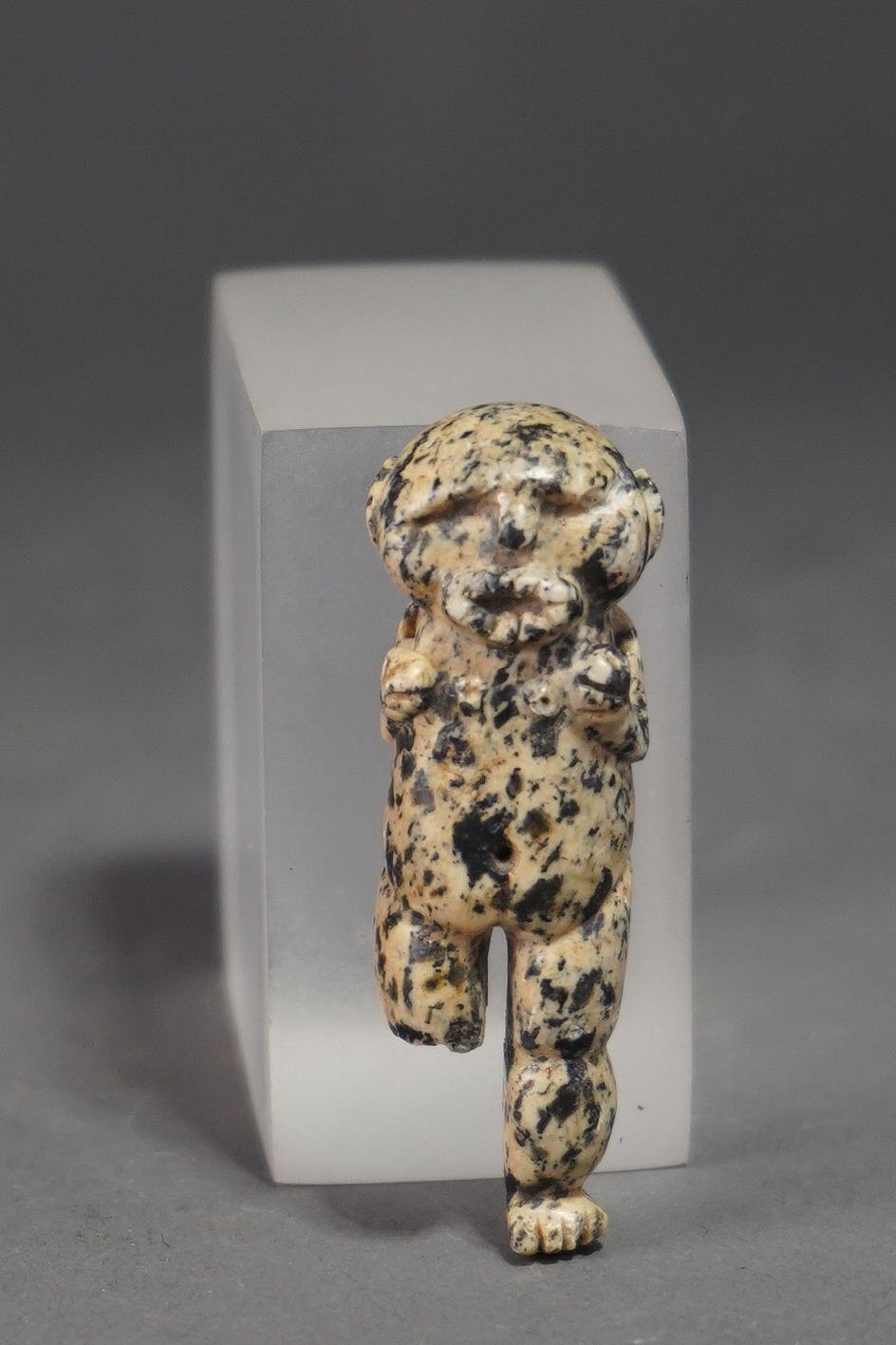 Panama, Veraguas Speckled Stone Pendant
This rare Veraguas anthropomorphic female bat deity bears a human body, a simian face, and bat-like ears.  There is a suspension hole near each shoulder for hanging the pendant on a string.  This pendant was exhibited in the Brooklyn Museum and published in the Jay Leff Collection, catalog no.500.  Acquired from Sotheby's, May 12, 1983, lot 13.
Period: Panama, Veraguas, c. AD 800 - 1500
Media: Stone
Dimensions: Height: 2.25"
$1,800
88048b