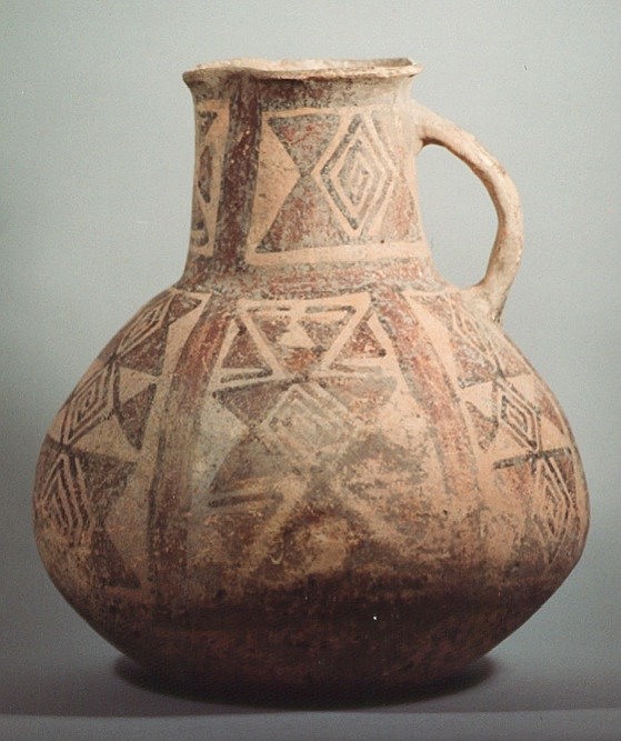 Bolivia, Bolivian Ceramic Vessel Decorated with Geometric Designs
Large ceramic jug handle vessel with geometric designs of concentric diamonds in red, brown, and black slip on a pink buff ground.  Vessels with similar designs are also found in Arica, Chile and Southern Bolivia, and appear to be a regional integration style.
Media: Ceramic
Dimensions: Height 11"
$2,800
94207x