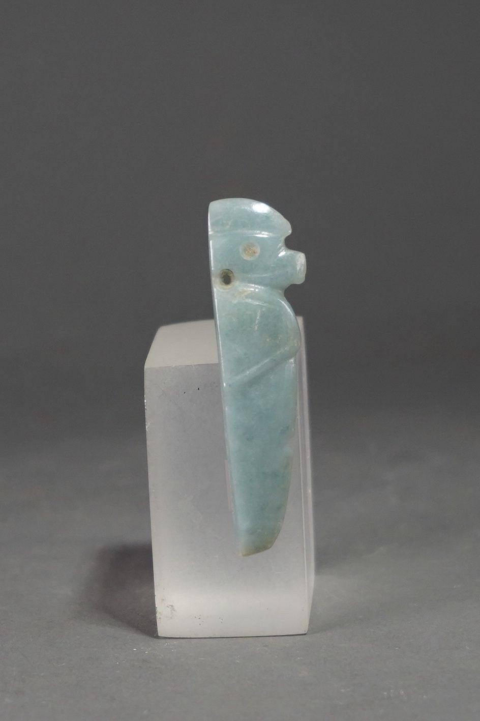 Costa Rica, Costa Rican Jade Harpy Eagle Deity Amulet
The harpy eagle is one of the most feared birds in Costa Rica.  This translucent, speckled jade stone eagle is carved to show the wings and beak on both sides.  One side is slightly convex and the other slightly concave.  There is a suspension hole by the neck.
Period: Costa Rica, Linea Vieja, Atlantic Watershed, c. 1 AD - 500
Media: Stone
Dimensions: Length 2 5/8" x Width: 3/4"   Thickness 1/4"
$975
M3060