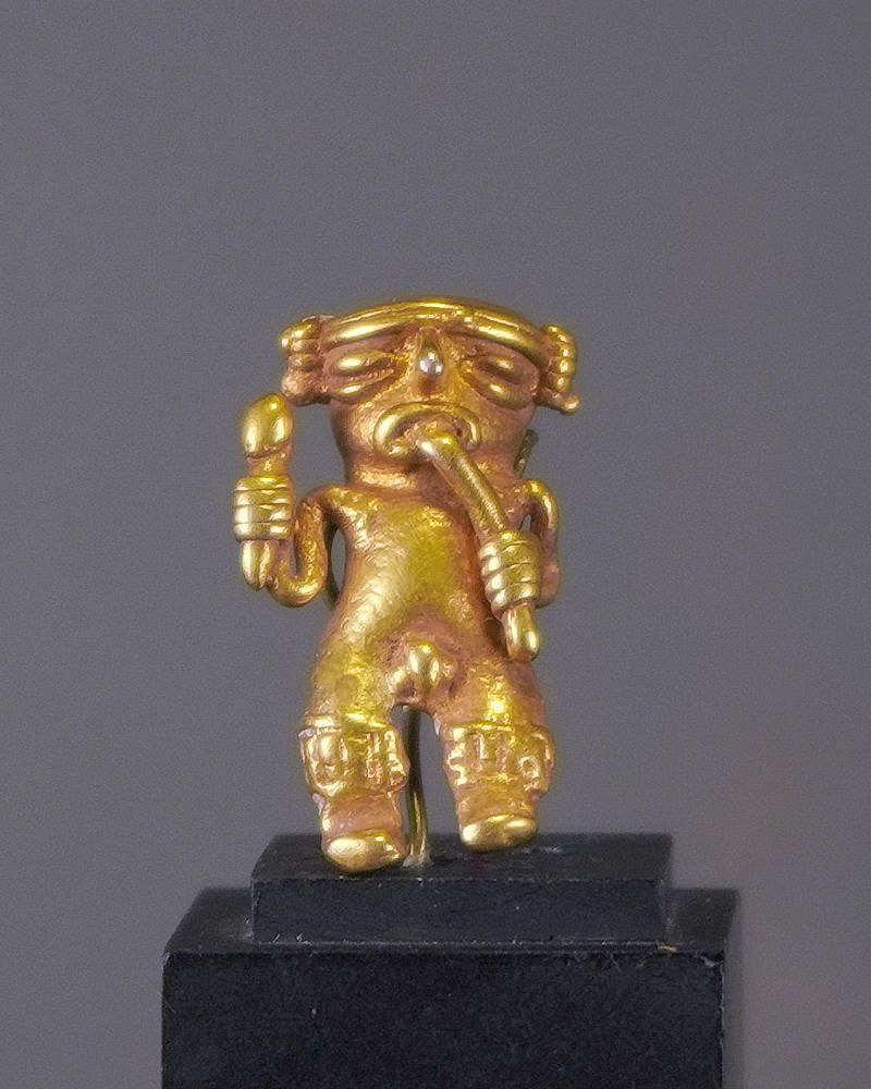 Costa Rica, Chiriqui Cast Gold Miniature Flute Player
This miniature gold shaman is seen playing a flute and holding a rattle in the left hand.  Music was known to facilitate trance states and psychological healing during psychedelic shamanic rituals.  A similar piece is illustrated in THE ART OF PRECOLUMBIAN GOLD - THE JAN MITCHELL COLLECTION on page 101. From the collection of Karin Ashburn by descent from her father Benno Mattel of Uruguay.
Media: Metal
Dimensions: Height: 1 1/16" ( 2.7cm) Weight: 4.9grams
$1,900
n4027C