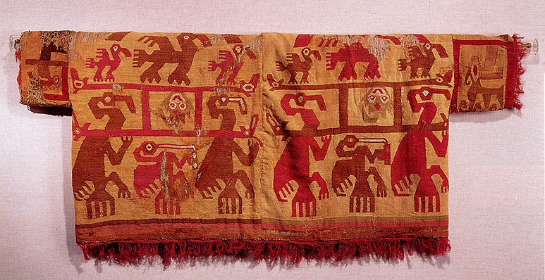 Peru, Chimu Tapestry Shirt with Pelican Narrative
This is a complete tapestry woven shirt with sleeves constructed of cotton warps and camelid wefts in red, brown, olive and white on an ochre ground.   It depicts a mythical marine narrative with two pelicans carrying a litter bearing a trophy head in the form of a skate with a face.  Litters were considered a prestigious mode of transportation on the North coast.  The presence of this image within the narrative reinforces the importance of the individual who wore this shirt.  There is a pelican with a crescent headdress on top of each litter.  Each of the four panels displays the same scene in reverse colors. This shirt is illustrated in Rowe, Ann, "Costumes and Featherwork of the Lords of Chimor" published by The Textile Museum, 1984, fig 103.  Formally in the collection of the Southwest Museum in California.
Media: Textile
Dimensions: Width 47-1/2" x Length 19-1/2"
Price Upon Request
96127