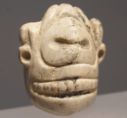 TaÃ­no  Stone Skull Head Fragment with Earrings and Skull Cap