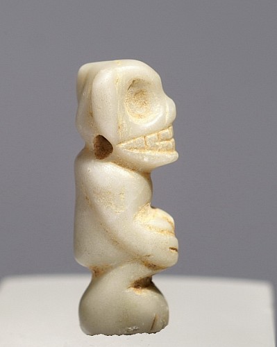 Work: Taíno  Carved white Stone Amulet of a Crouching Skeletal Figure