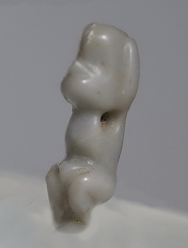 Dominican Republic, Small Taíno  Amulet of a Crouching Monkey in Blue-Gray Stone
In this lovely example, the craftsman selected a blue-grey stone not common in the area.  The crouching figure is carved with nice details, with a simian face, large ears, and a phallus.  This amulet is quite artistic.
Period: Dominican Republic, Taíno , Early Classic Period, c. AD 600 - 1000
Media: Stone
Dimensions: Height: 1"
99365