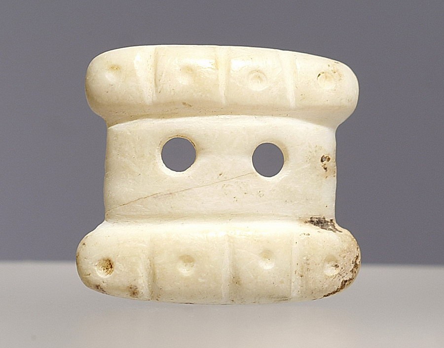 Dominican Republic, Taíno  Shell Square Dress AppliquÃ©
This miniature shell appliquÃ© belonged to a larger set that once covered the tunic of a chief.  It's hard to imagine the time and care required to make such an ornament.
Period: Dominican Republic, Taíno , c. AD 1000 - 1500
Media: Shell
Dimensions: Height: 5/8 x Width: 6/8"
99370