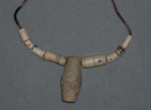 Work: Taíno  Necklace with Nine Carved Stone Beads in Varying Sizes