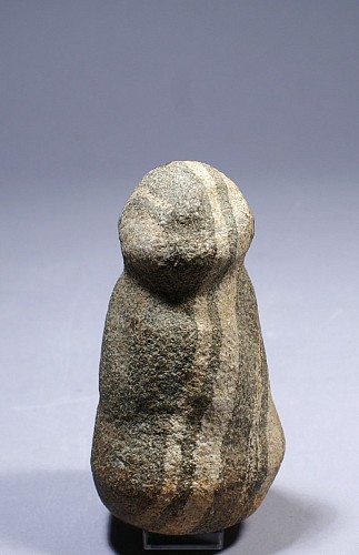 TaÃ­no  Striated Stone Pestle a Depicting a Stylized Figure