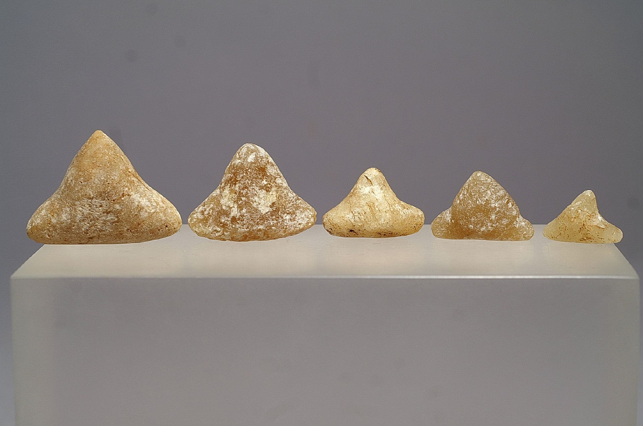 Dominican Republic, Five Taíno Miniature Quartz Three-Pointers
Quartz and rock crystal were prized for their power as sacred stones that enabled shamans to see into the otherworld of spirits and ancestors.  This group of three-pointers  is from the earlier Taíno  period.
Period: Dominican Republic, Taíno , Early Classic Period, c. AD 600 - 1000
Media: Stone
Dimensions: Height Range: 1/2" to 1 1/4"
99348