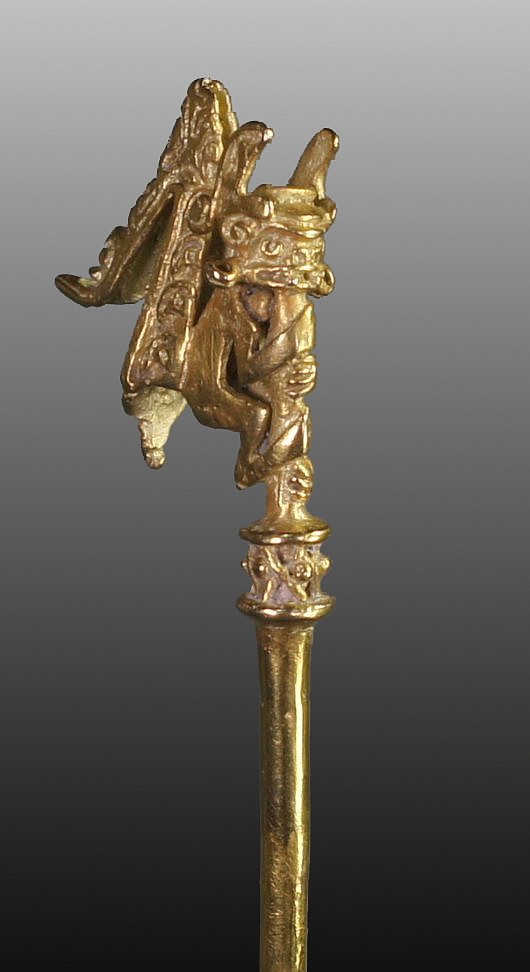 Colombia, Early Calima Gold Lime Dipper
A fine lost wax cast lime dipper with a mythological monkey deity on the tip.  The monkey wears a helmet, ear spools, and an elaborate headdress which falls down the back of his body.  Lime dippers were used to mix lime with crushed leaves from the Erythroxylum coca plant (from which cocaine is derived) to create a drug compound that functioned as a psychoactive stimulant used in ritual ceremonies.  According to the research, only limited types of imagery was used for lime dippers, usually shamans or warriors. See Calima and Malagana, by Marianne Cardale Schrimpff for further reading.  A similar but not exact motif is also illustrated in Orfebreria Prehispanica de Colombia on page 84, plate # 5232.
Period: Colombia, Calima, Yotoco Phase, Cauca River Valley, c. AD 100 - 1000
Media: Metal
Dimensions: Length: 8 1/2"  Weight: 25 grams.
$9,500
97146