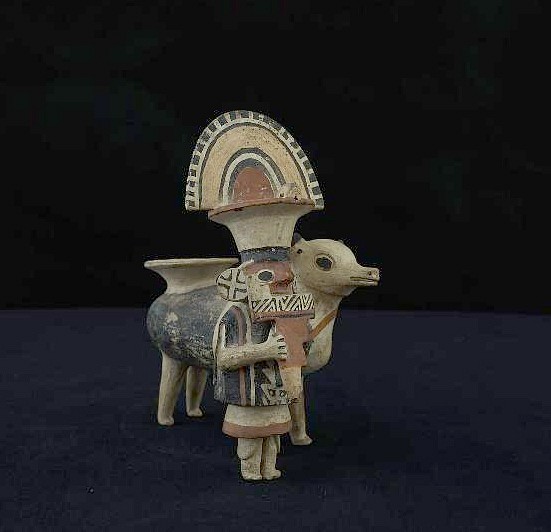 Peru, Recuay Ceramic Figure of Standing Flute Player with Llama
The Recuay culture were mostly sheep herders, and achieved sophisticated craftsmanship in ceramics, metalwork and weavings. Recuay ceramic artisans were renowned for their intricate ceramic architectural models depicting miniature temple layouts, as well as their expressive figurative sculpture depicting figures, deities, and animals in scenes from both everyday life as well as mythology.   From the Peruvian ceramic collection of Benno Mattel, Punta del Este, Uruguay, acquired prior to the 1960s.
Media: Ceramic
Dimensions: Height: 7 1/2"
$15,000
Z082